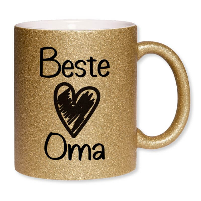 „Goldene Glitzertasse mit dem Aufdruck "Beste Oma" und einem schwarzen Herzmotiv.