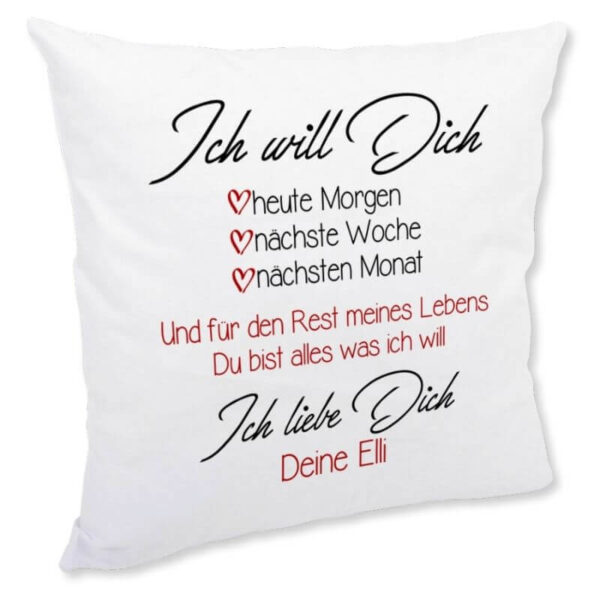 Weißes Kuschelkissen mit dem Spruch „Ich will Dich – heute Morgen, nächste Woche, nächsten Monat … Ich liebe Dich. Deine Elli“ in schwarzer und roter Schrift, personalisierbar mit Namen.