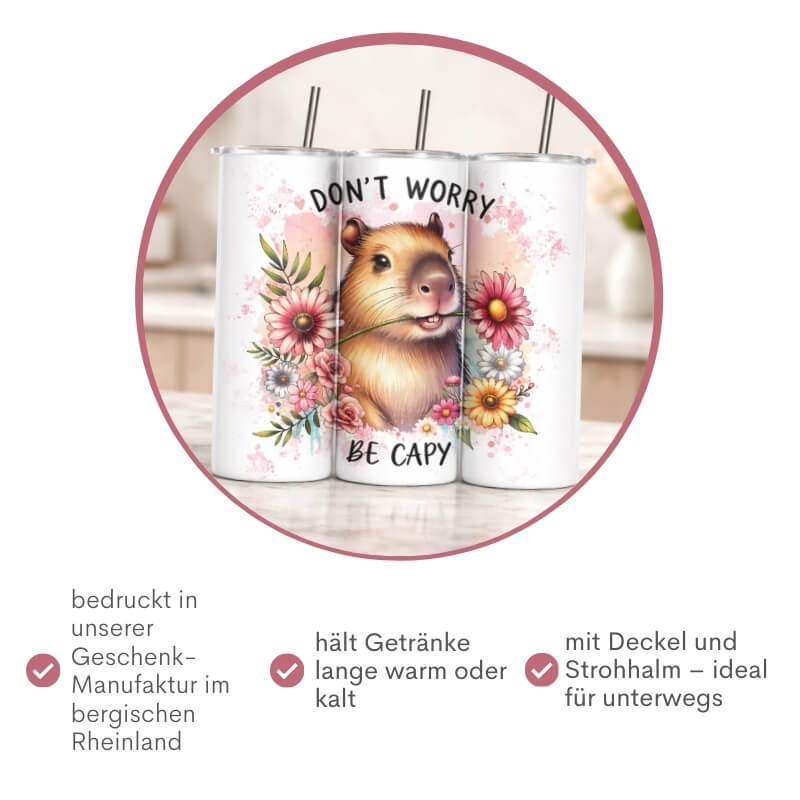 Capybara Thermobecher „Don't Worry Be Capy" mit Blumenmotiv, bedruckt in der Geschenkemanufaktur Majas Geschenkewelt im bergischen Rheinland – mit Deckel und Strohhalm, ideal für unterwegs